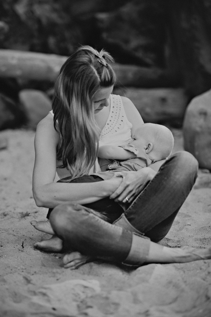 mother breastfeeding her baby on hornby island, bc