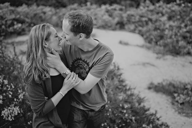 man & woman embracing on the beach, comox valley, vancouver island, bc