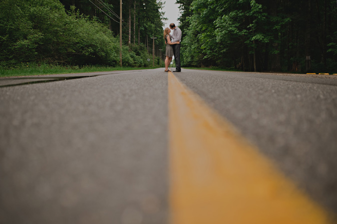 a couple in the middle of the road, seal bay provincial park, comox, bc